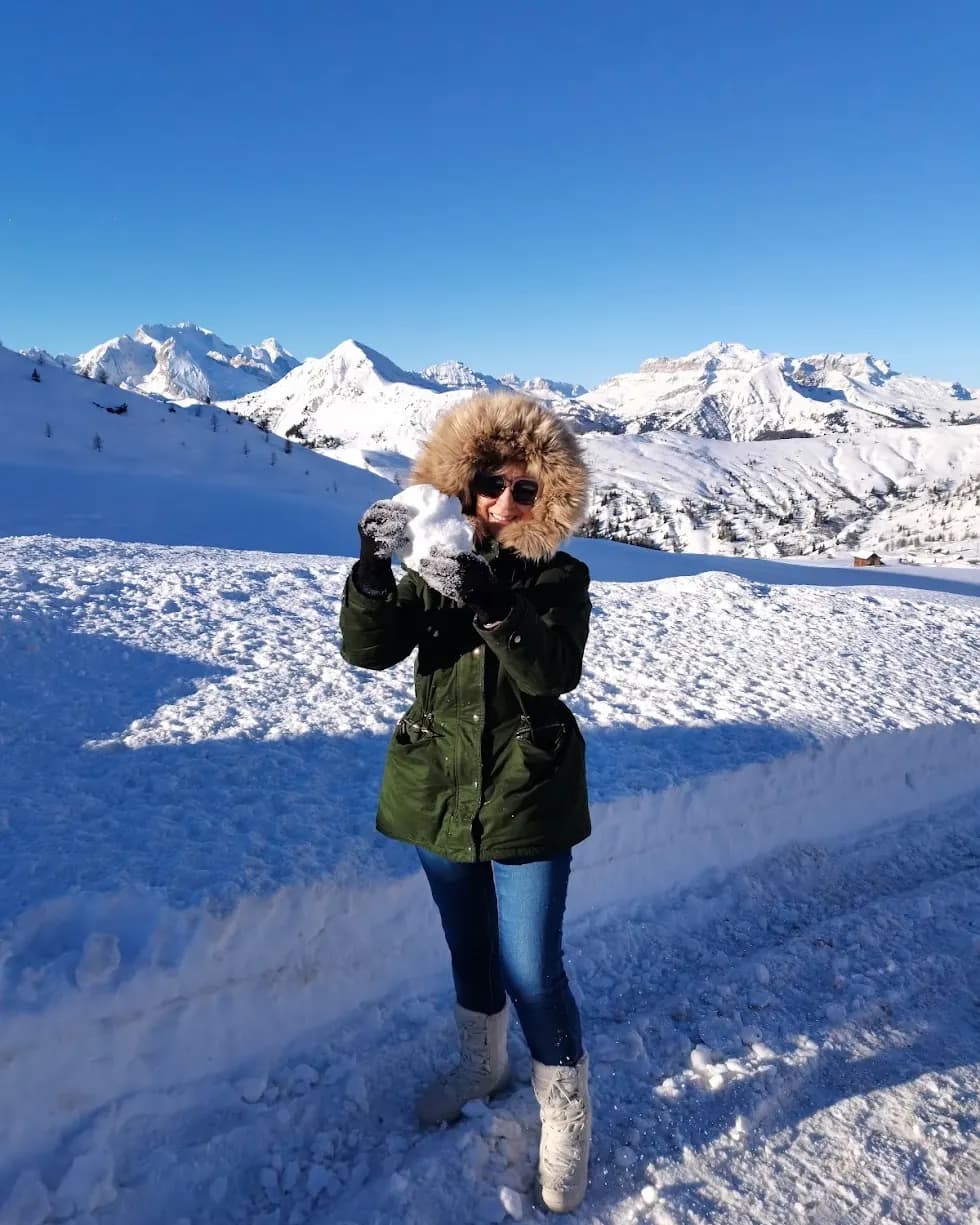 My mother on a snowy mountainside during a trip